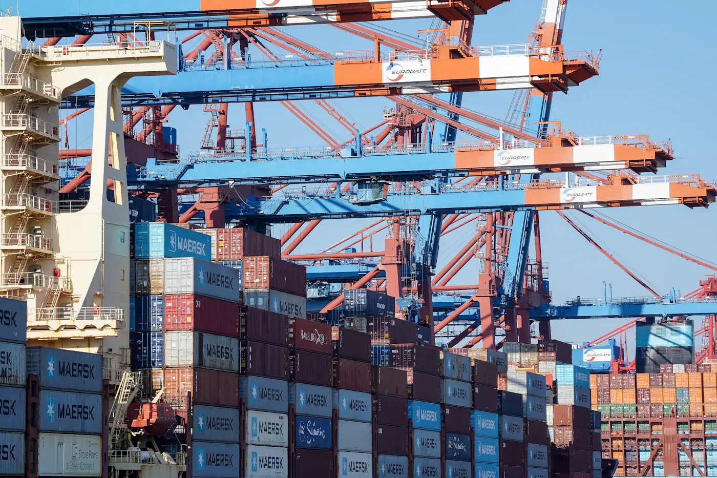 Gantry cranes loading shipping containers at a port